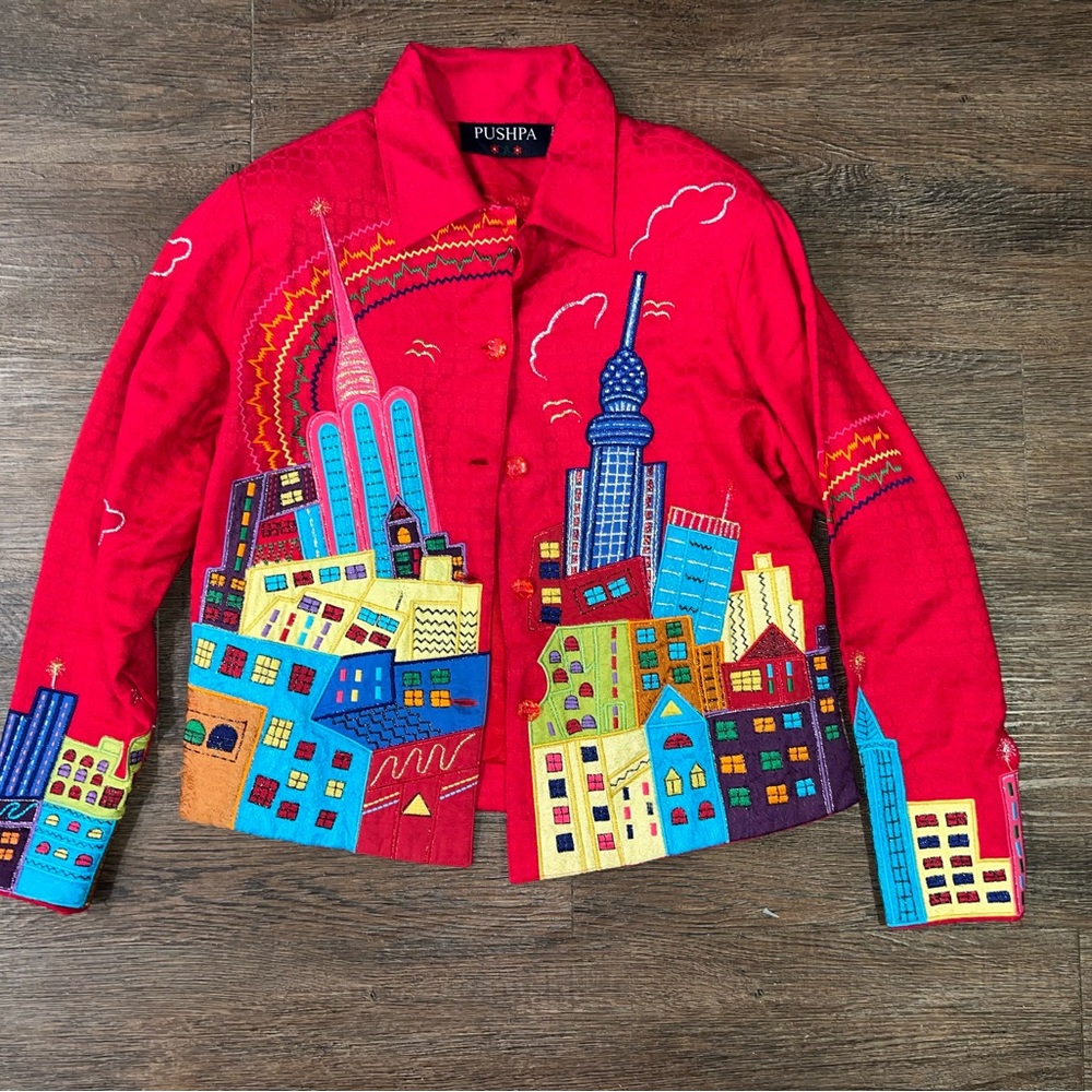 Size small Pushpa brand red jacket.  Colorful buildings.  City. Blazer